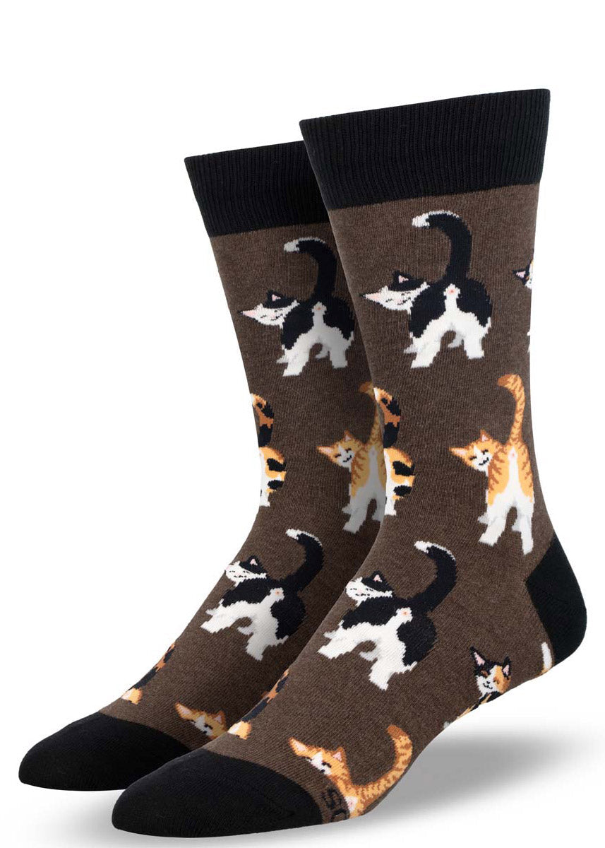 Brown crew socks for men with an allover pattern of different kinds of cats such as orange tabbies and calicos posing with their behind showing.