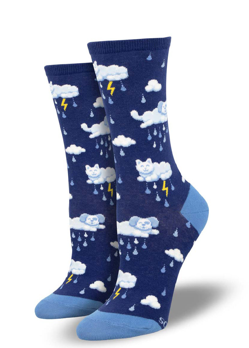 Dark blue crew socks for women with an allover pattern of rain drops and storm clouds shaped like cats and dogs.