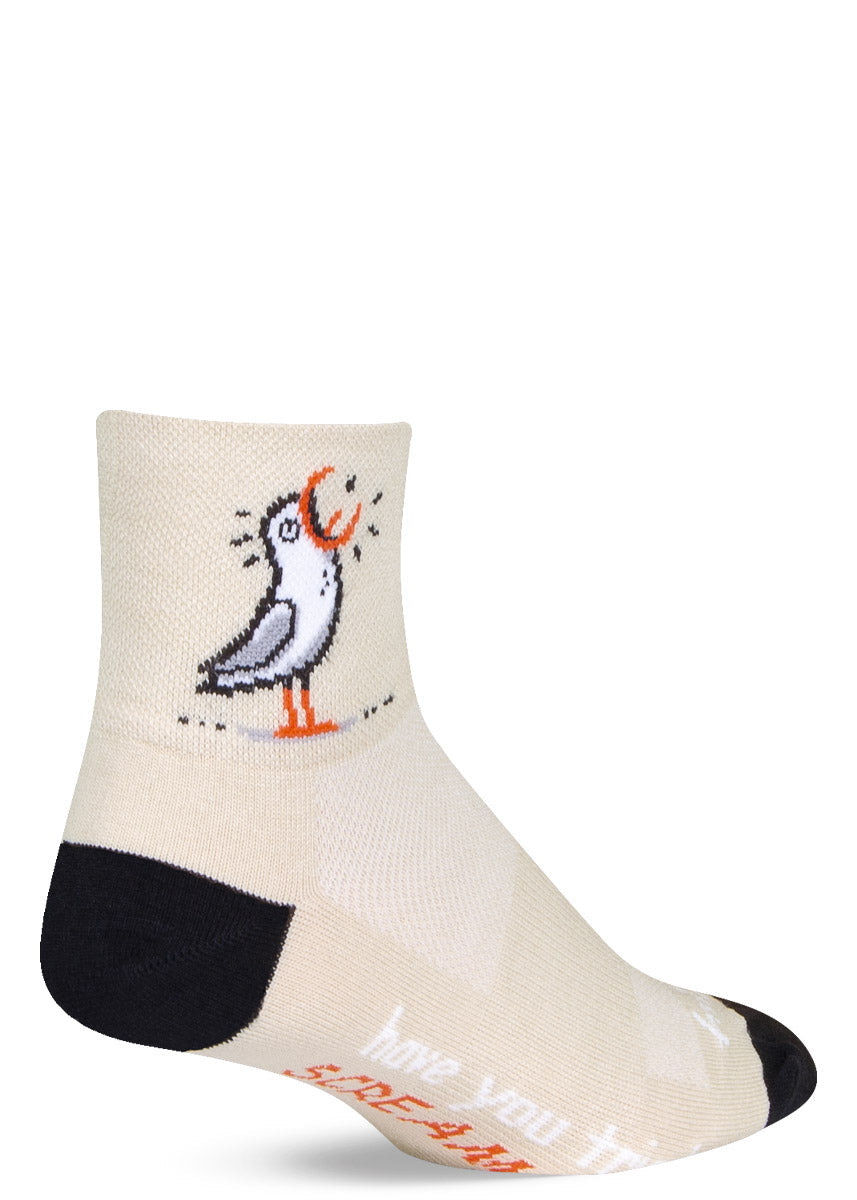 Cream athletic ankle socks with a design of a screaming cartoon seagull and the words "have you tried SCREAMING?" written on the bottom of the foot.