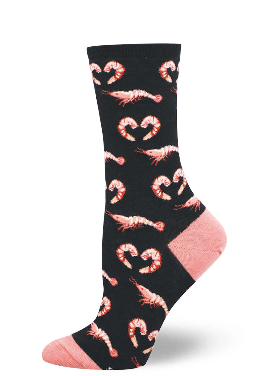 Black women's crew sock with a pattern of pink shrimp.