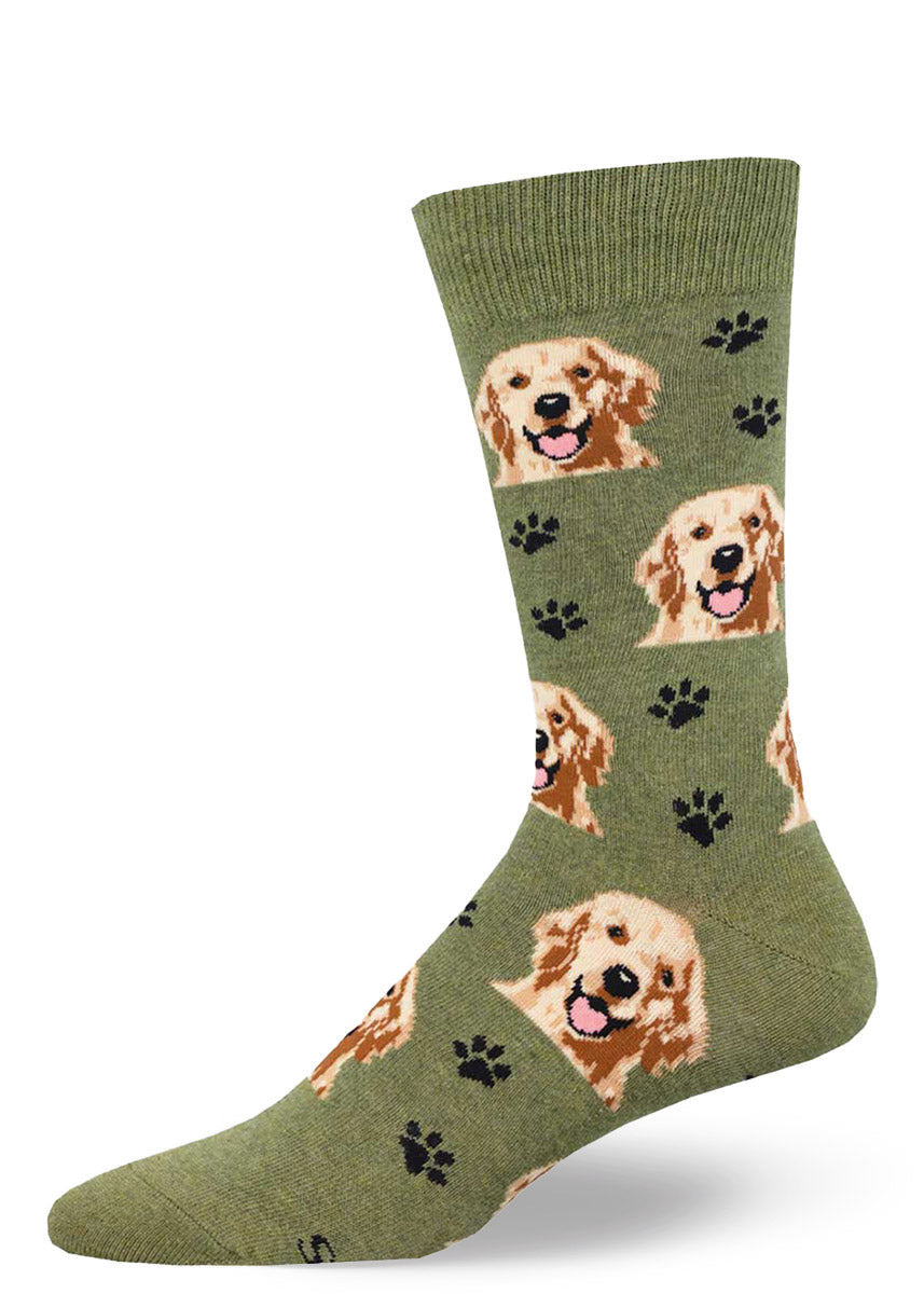 Green heather crew socks for men with an allover pattern of golden retriever faces and black paw prints.