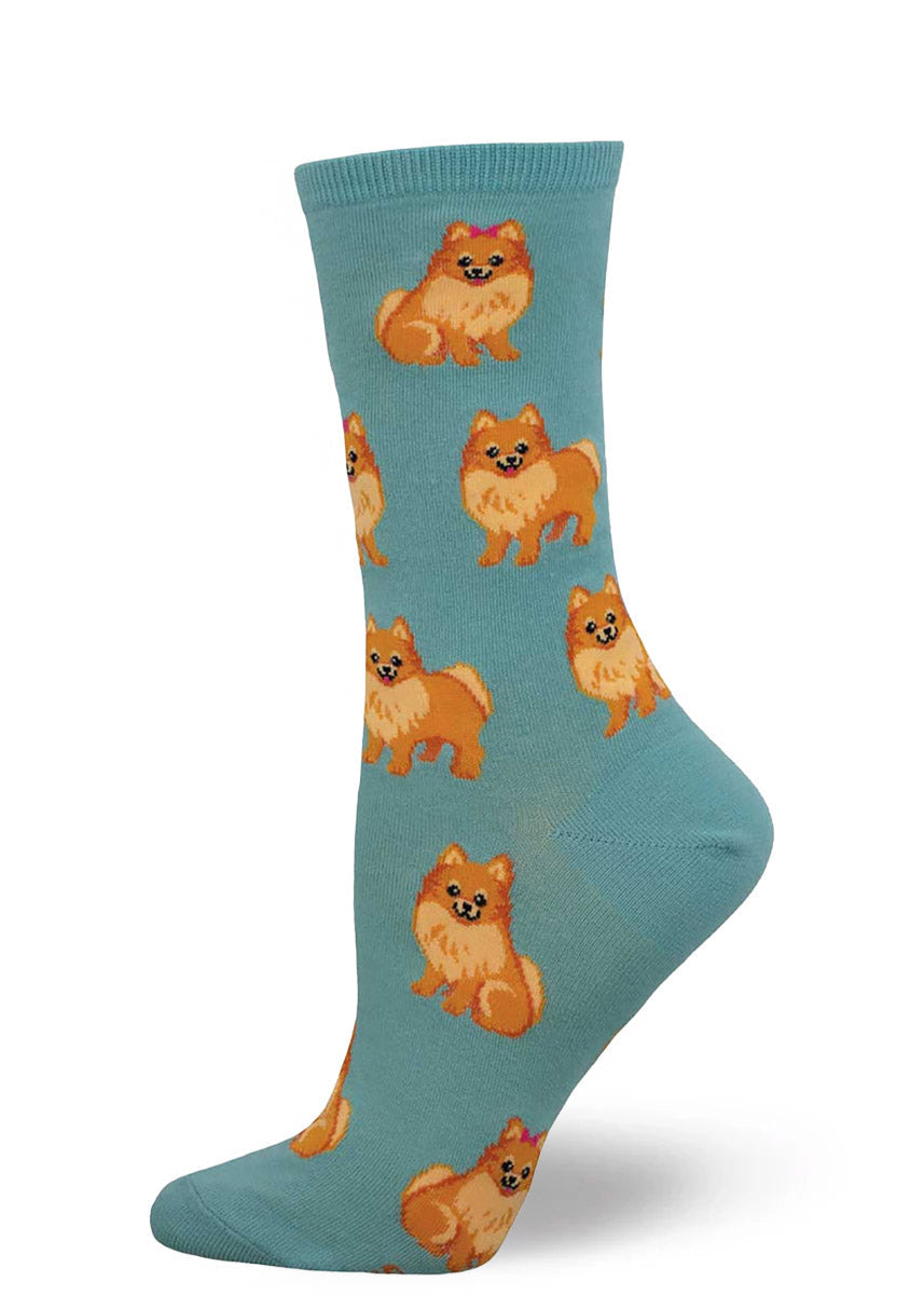 Blue crew socks for women with an allover pattern of pomeranian dogs. 