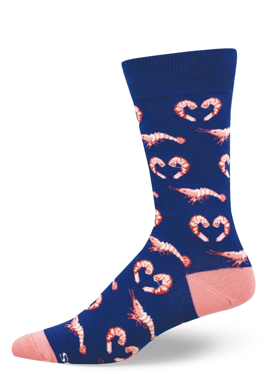 Dark blue crew socks for men with an allover pattern of pink shrimp, with some of the shrimp curled into the shape of a heart.