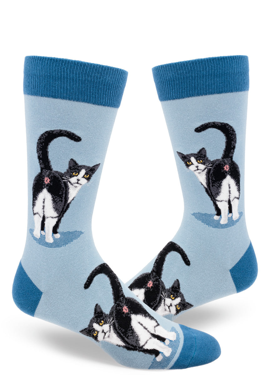 Slate blue men's crew socks with a design of tuxedo cats inviting you to peek at their butts.