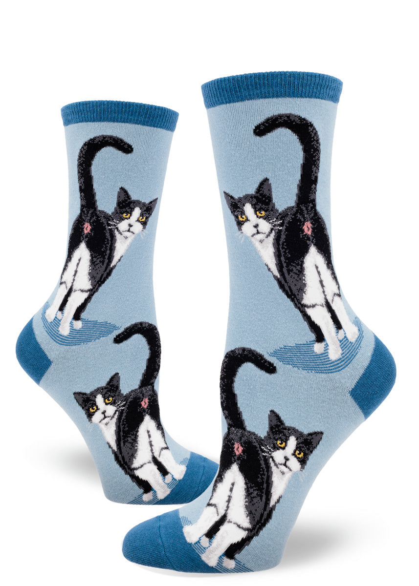 Slate blue women's crew socks with a design of tuxedo cats inviting you to peek at their butts.